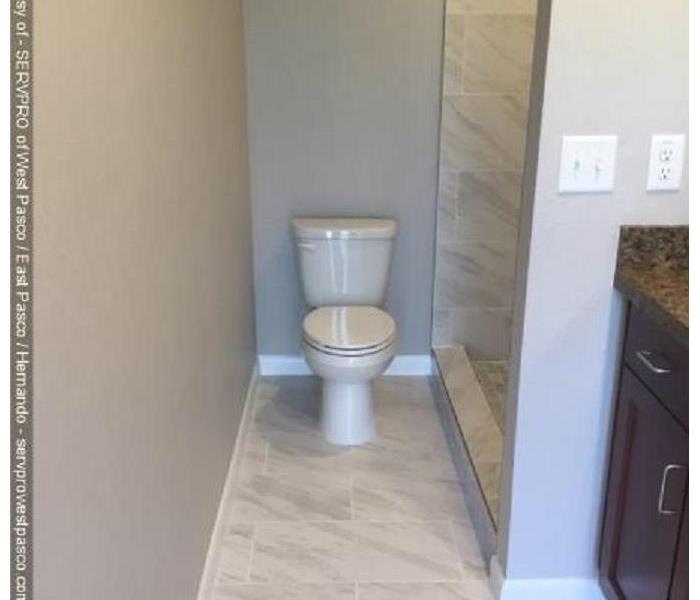 white toilet and clean bathroom after house fire remediation