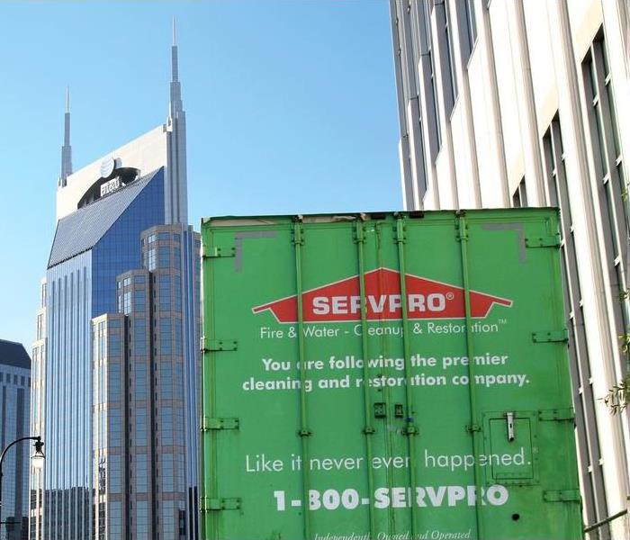 SERVPRO Trailer In Front Of Buildings In Metro Area.